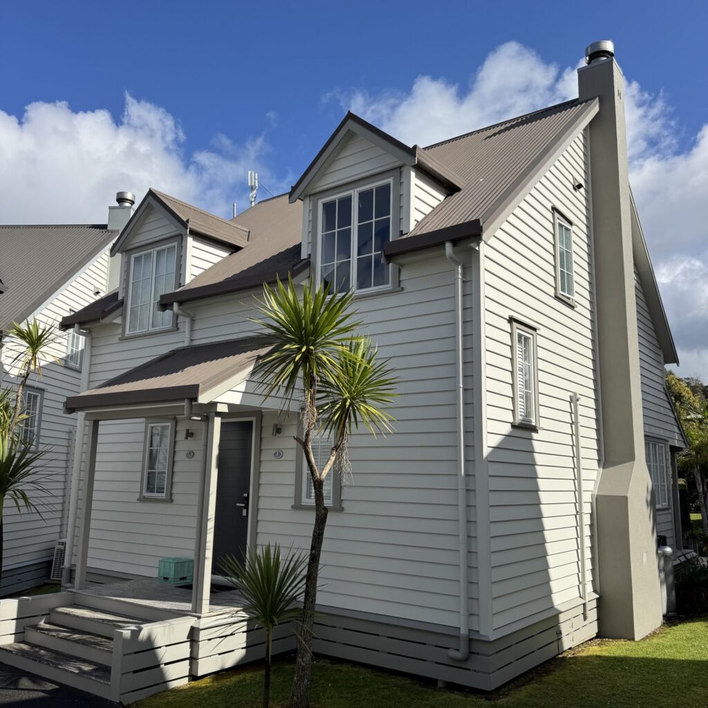 Kauri Cottage exterior Exterior view of Kauri Cottage, offering premium boutique Russell accommodation at the historic Russell Cottages complex.