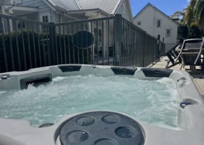 The fully fenced shared outdoor spa pool and hot tub facility available to guests staying at Crab Shack Cottage.
